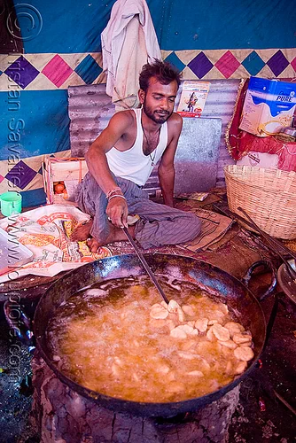 deep-frying - langar (free community kitchen) - amarnath yatra (pilgrimage) - kashmir, amarnath yatra, cooking oil, cooks, deep-frying, food, hindu pilgrimage, kashmir, kitchen, langar, man, sikh, sikhism, wok