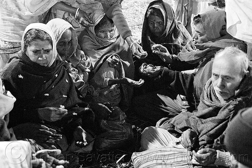 family of hindu pilgrims performing ceremony before holy bath (india), ceremony, family, hands, hindu pilgrimage, hinduism, kumbh mela, men, offerings, paush purnima, pilgrims, praying circle, ritual, sitting, straw, women