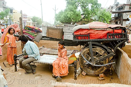 gadia lohars nomadic tribe camp and oxcart (india), bullock cart, camp, chariot, encampment, gadia lohars, gaduliya lohars, gipsies, gypsies, horse cart, little girls, man, nomadic tribe, nomads, ox cart, road, thiya