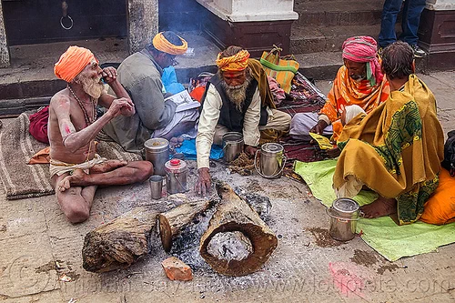group of sadhus (hindu holy men) sitting near their bonfires (nepal), baba, beard, bonfire, cross-legged, hindu, hinduism, kathmandu, maha shivaratri, man, pashupatinath, sadhu, sitting, smoke
