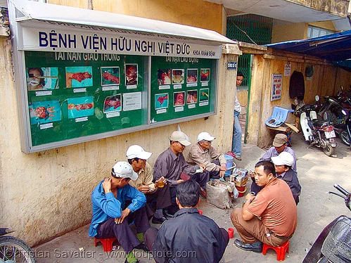 gruesome photos on hospital wall - vietnam, accidents, body parts, dismembered, emergency room, er, flesh, hanoi, hospital, maimed, medics, men, severe injuries, severed fingers, severed limbs, sign, surgery, torn, trauma