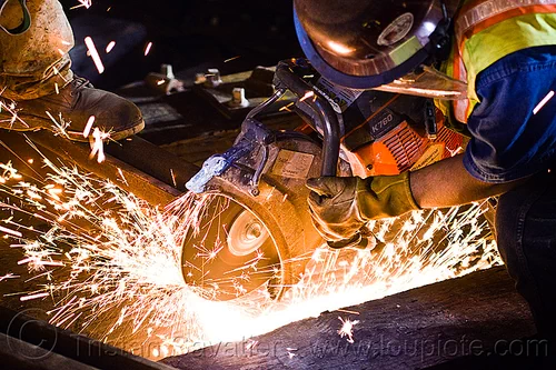 handheld cut-off saw, abrasive saw, cut-off saw, cutting, high-visibility jacket, high-visibility vest, huskvama, k760, light rail, man, muni, night, ntk, power tool, railroad construction, railroad tracks, railway tracks, reflective jacket, reflective vest, safety helmet, safety vest, san francisco municipal railway, sparks, track maintenance, track work, worker, working