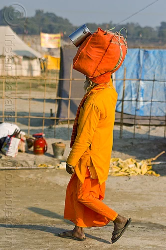 hindu pilgrim walking with bag on head (india), bag, bhagwa, carrying on the head, hindu pilgrimage, hinduism, kumbh mela, luggage, man, pilgrim, saffron color, walking