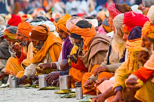 hindu pilgrims eating holy prasad - kumbh mela 2013 (india), ashram, bhagwa, crowd, dinner, eating, food, hindu pilgrimage, hinduism, holy prasad, kumbh mela, men, pilgrims, rows, saffron color, sitting
