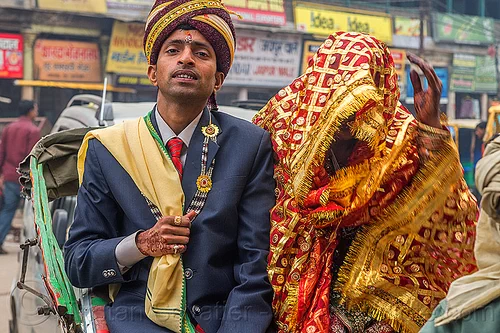 indian wedding - proud groom holding his covered bride like a trophy, bindi, bride, dressed-up, groom, hand mehndi, headdress, indian man, indian wedding, indian woman, scarf, suit, tilak, tilaka, traditional, turban, varanasi