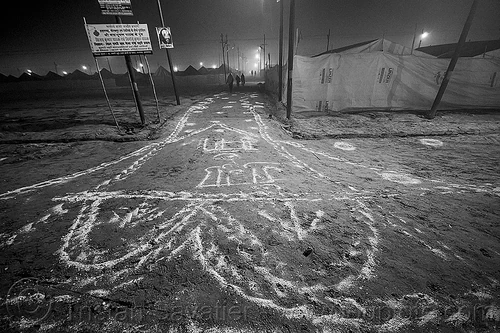 lime powder patterns and writings on the ground at kumbh mela (india), bleach powder, disinfection, drawings, hindu pilgrimage, hinduism, kumbh maha snan, kumbh mela, lime powder, mauni amavasya, night