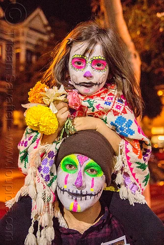 little girl with sugar skull makeup - sitting on man's shoulders - dia de los muertos, child, daughter, day of the dead, dia de los muertos, face painting, facepaint, father, flowers, halloween, kid, knitcap, little girl, man, neon colors, night, sugar skull makeup