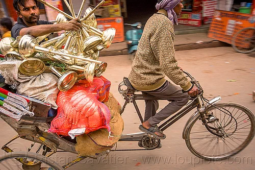 man carrying large objects on a cycle rickshaw, bags, cargo, carrying, cycle rickshaw, freight, men, moving, riding, sacks, varanasi