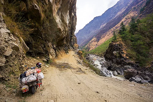 motorbike on road between tatopani and jomsom (nepal), annapurnas, bags, cliff, dirt road, kali gandaki river, kali gandaki valley, luggage, motorcycle touring, mountain river, mountain road, mountains, sacks, stream, unpaved