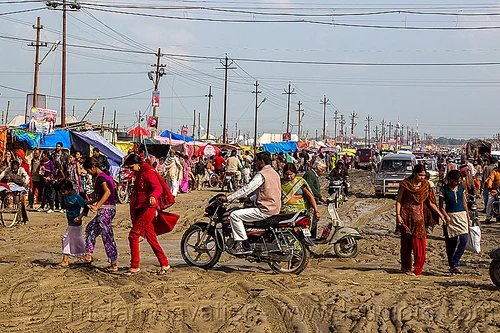 muddy market street (india), botorcycle, hindu pilgrimage, hinduism, kumbh mela, mud ruts, muddy road, muddy street, traffic, underbone motorcycle, walking