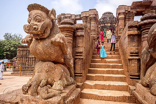 mustachioed stone tiger over elephant - konark sun temple (india), hindu temple, hinduism, konark sun temple, sculptures, stairs, statue, steps, stone elephant, tourists