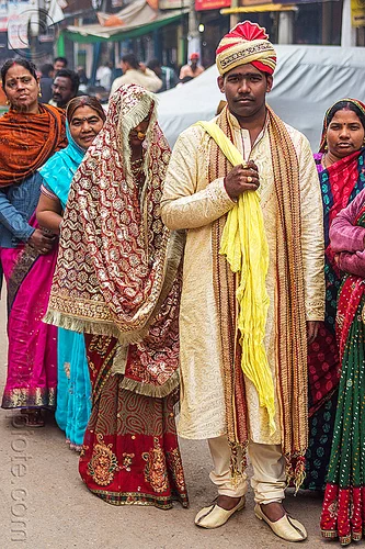 newlyweds - indian wedding - groom holding bride in tow like a trophy, bride, dressed-up, groom, headdress, indian wedding, indian woman, indian women, man, traditional, turban, varanasi
