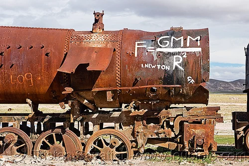 newton's universal law of gravitation equation - graffiti on steam locomotive, bolivia, enfe, equation, fca, graffiti, gravitation, newton, physics, railroad, railway, rusty, science, scrapyard, steam engine, steam locomotive, steam train engine, train cemetery, train graveyard, train junkyard, uyuni