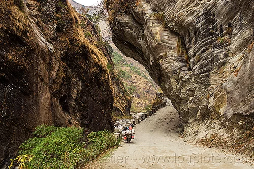 overhanging rock in narrow gorge near tatopani - road between beni and jomsom (nepal), annapurnas, canyon, cliff, dirt road, gorge, kali gandaki valley, motorcycle touring, mountain road, mountains, overhanging rock, unpaved