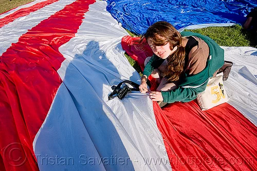 phoebe sewing the giant american flag - dolores park (san francisco), american flag, camera, giant flag, mending, phoebe, photographer, sewing, stitching, the flag project, us flag, woman