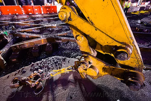 rail tongs - muni railway construction site (san francisco), attachment, diamond crossing, hydraulic arm, light rail, muni, ntk, rail tongs, railroad construction, railroad tracks, railway tracks, san francisco municipal railway, track maintenance, track work