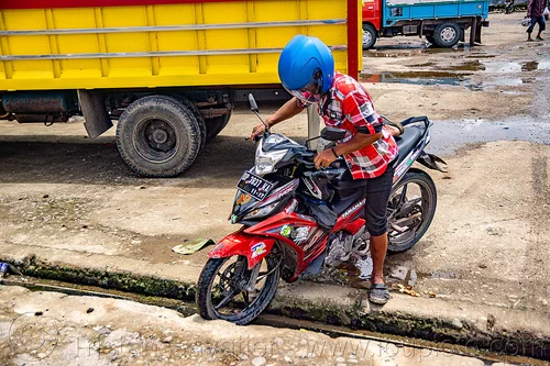 riding motorbike in rantepao, bolu market, man, pasar bolu, rantepao, tana toraja