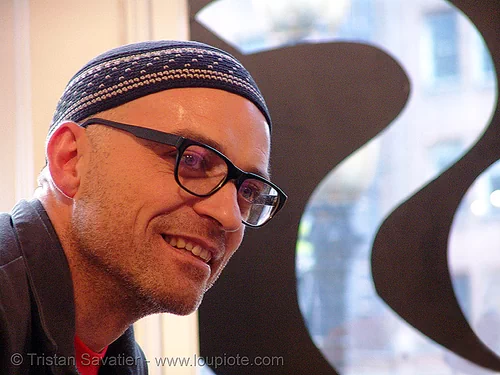 rigo 23 (san francisco), black frame, eyeglasses, eyewear, hat, man, muralist, painter, prescription glasses, ricardo gouveia, rigo, rigo23, spectacles