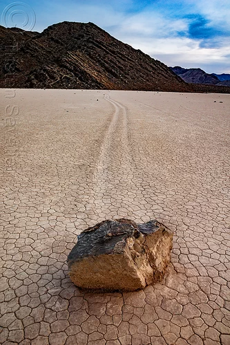 sailing stone on the racetrack - death valley, cracked mud, death valley, dry lake, dry mud, landscape, mountains, racetrack playa, sailing stones, sliding rocks