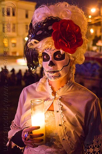 skull makeup and victorian attire - white wig - red flower headdress, candle light, class candle, day of the dead, dia de los muertos, face painting, facepaint, halloween, lace, mexican candle, night, red flower headdress, sugar skull makeup, white wig, woman