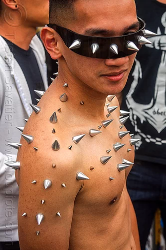 Man with Spikes Glued on Skin