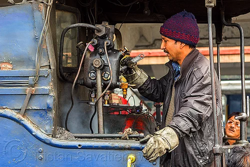 steam locomotive operator adjusting hydrostatic lubricator with adjustable wrench - darjeeling (india), 788 tusker, controls, darjeeling himalayan railway, darjeeling toy train, hydrostatic displacement lubricator, hydrostatic lubricator, man, mechanical lubricator, narrow gauge, operator, railroad, steam engine, steam locomotive, steam train engine, valves, worker, working, wrench