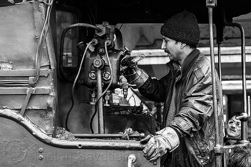 steam locomotive operator adjusting hydrostatic lubricator with adjustable wrench - darjeeling (india), 788 tusker, controls, darjeeling himalayan railway, darjeeling toy train, hydrostatic displacement lubricator, hydrostatic lubricator, man, mechanical lubricator, narrow gauge, operator, railroad, steam engine, steam locomotive, steam train engine, valves, worker, working, wrench
