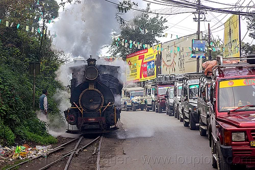 steam locomotive sharing road with cars - darjeeling (india), 788 tusker, cars, darjeeling himalayan railway, darjeeling toy train, narrow gauge, railroad switch, railroad tracks, road, smoke, smoking, steam engine, steam locomotive, steam train engine, traffic jam