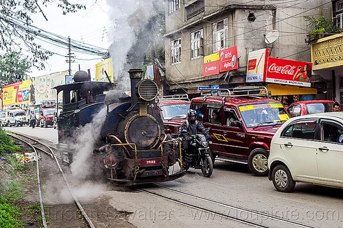 steam locomotive sharing road with cars traffic - darjeeling (india), 788 tusker, cars, darjeeling himalayan railway, darjeeling toy train, motorcycle, narrow gauge, railroad switch, railroad tracks, road, smoke, smoking, steam engine, steam locomotive, steam train engine, traffic jam