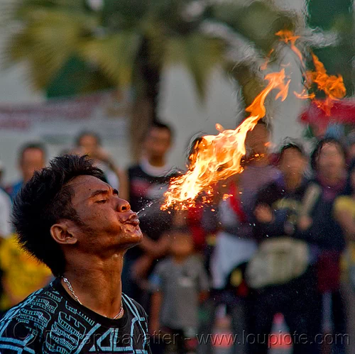 street circus performer breathing fire (jakarta), crowd, eid ul-fitr, fatahillah square, fire breather, fire breathing, fire performer, jakarta, spectators, spitting fire, street performer, taman fatahillah