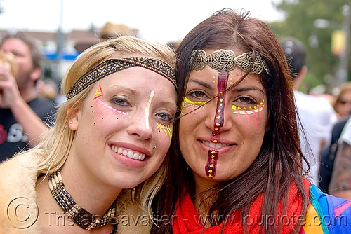 two women with tribal makeup and jewelry, andis, bay to breakers, costume, face painting, facepaint, footrace, headdress, hippie, jewelry, makeup, necklace, street party, tribal, woman