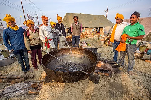 washing a large cooking pot in an ashram (india), ashram, big, cooking pot, group, hindu pilgrimage, hinduism, huge, kumbh mela, large, men, washing, water hose