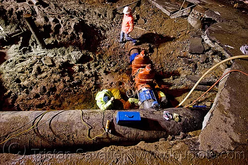 water main pipeline and cutoff valves - sinkhole - utility workers fixing broken water main (san francisco), awwa c515, construction workers, cut-off valves, gate valves, hetch hetchy water system, high-visibility vest, night, reflective vest, repairing, resilient, safety helmet, safety vest, sfpuc, sink hole, utility crew, utility workers, water department, water main, water pipe, working