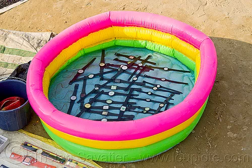 waterproof wristwatches sold by street seller (india), hindu pilgrimage, hinduism, kumbh mela, pool, street market, street seller, street vendor, watches, waterproof, wristwatches