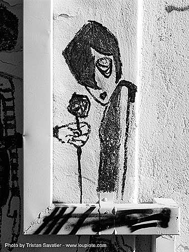 woman being offered a rose - graffiti, love graffiti, street art, trespassing