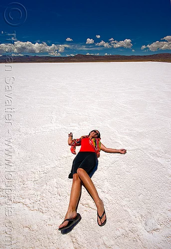 woman laying on salt flat - salinas grandes - salar (argentina), argentina, blue sky, charlotte, halite, horizon, jujuy, laying down, noroeste argentino, rock salt, salar, salinas grandes, salt bed, salt flats, salt lake, white, woman