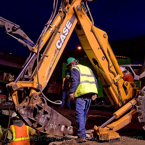 worker under backhoe with hydraulic hammer - utility workers fixing broken water main (san francisco), backhoe, case, construction workers, contractor, extendahoe, hetch hetchy water system, high-visibility vest, hydraulic attachment, hydraulic hammer, night, reflective vest, repairing, safety helmet, safety vest, sfpuc, sink hole, utility crew, utility workers, water department, water main, water pipe, working