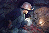 miner hammering chisel to drill blasting hole, bolivia, cerro rico, chisel, drilling, hammer, man, mina candelaria, mine tunnel, mine worker, miner, mining, potosí, safety helmet, squatting, underground mine, working